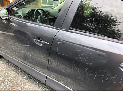 Racist marks scratched on car